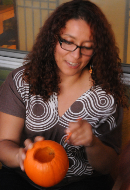 Jackie carving a pumpkin